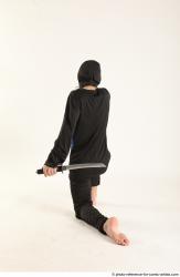 VLASTIMIL KNEELING POSE WITH GUN